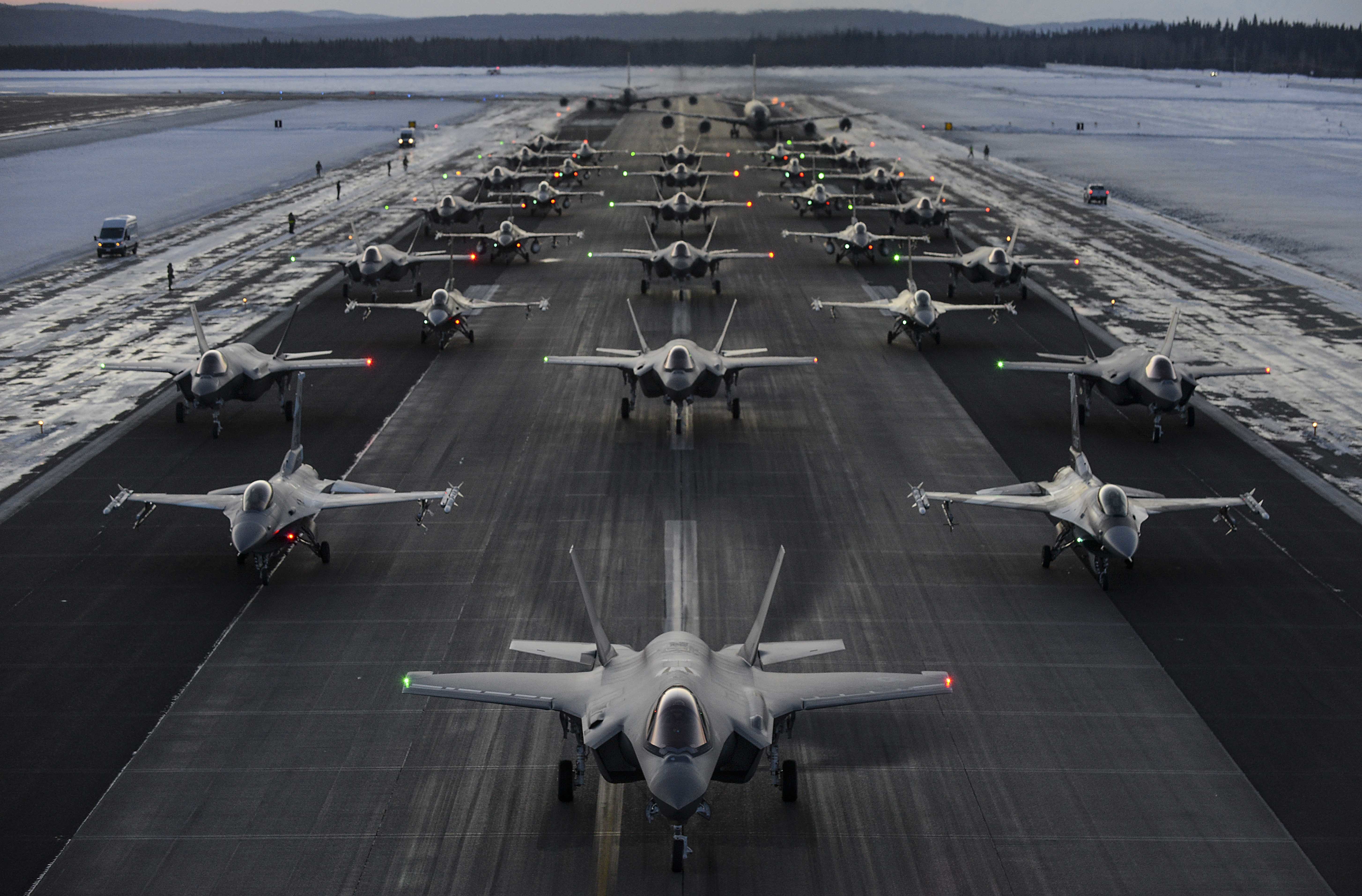 Over 30 aircraft perform an elephant walk on the flightline